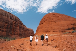 group of people walking in Kata Tjuta